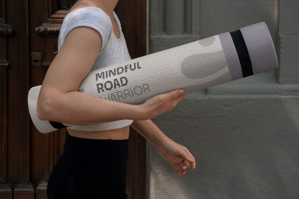 a person holding a yoga mat, mindful, yoga, meditation